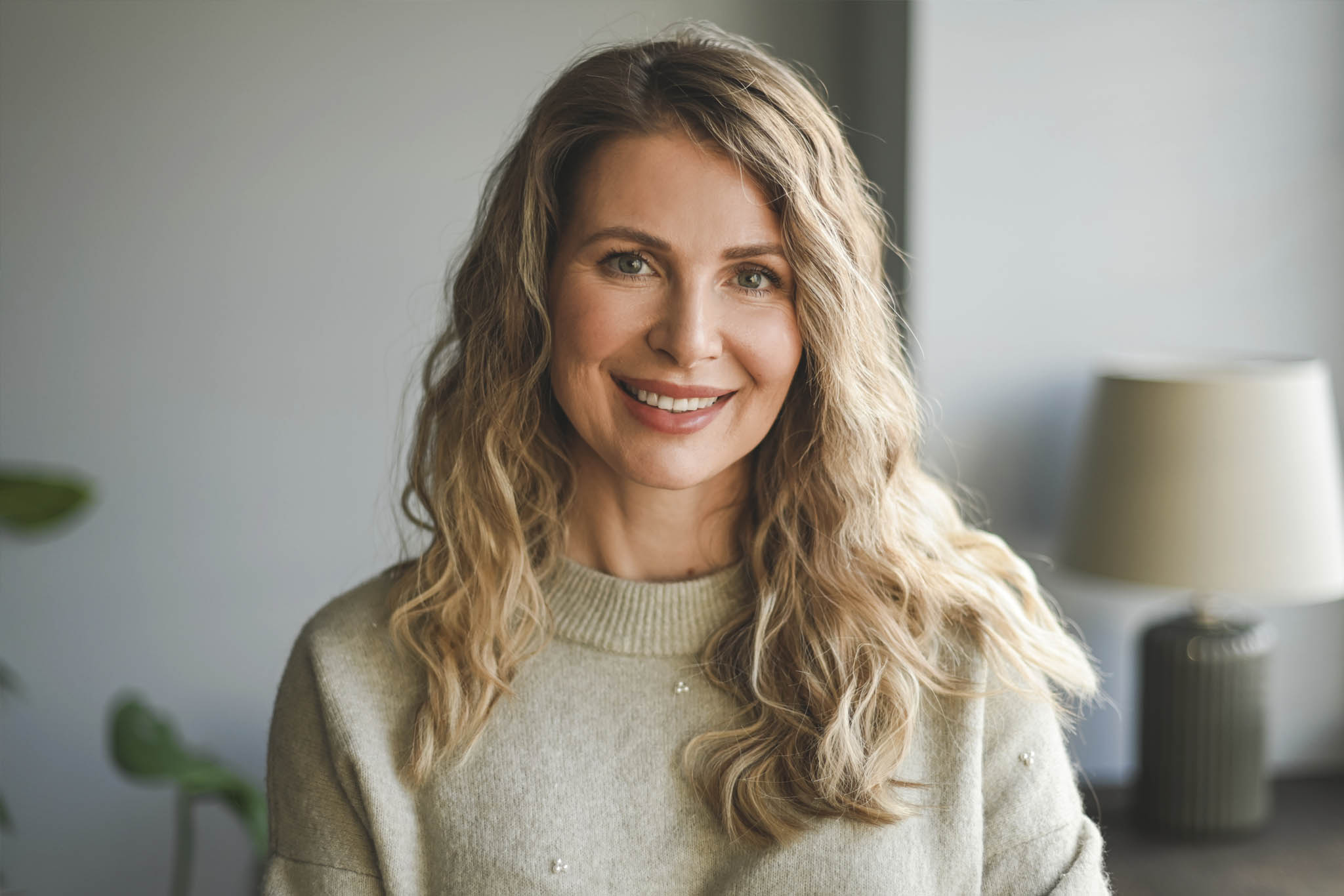 Beautiful middle aged woman smiling at the camera.